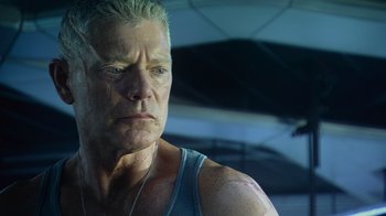 Movie still from “Avatar” (2009), directed by James Cameron – An older man is looking into the distance; Close Up shot, Low angle