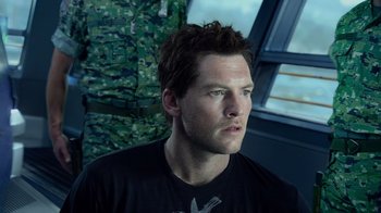 Movie still from “Avatar” (2009), directed by James Cameron – A person wearing a black t - shirt; Close Up shot, Low angle