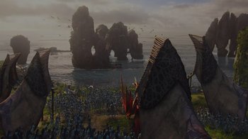 Movie still from “Avatar” (2009), directed by James Cameron – A group of people standing on top of a grass covered field; Extreme Wide shot, High angle