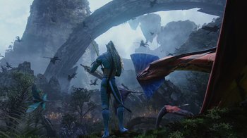 Movie still from “Avatar” (2009), directed by James Cameron – An image of a man standing in front of a dragon; Extreme Wide shot, Low angle