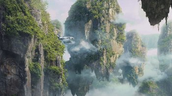 Movie still from “Avatar” (2009), directed by James Cameron – An airplane is flying through the air near some mountains; Extreme Wide shot, Low angle