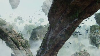 Movie still from “Avatar” (2009), directed by James Cameron – Birds flying over a cliff in the middle of the day; Extreme Wide shot, Low angle