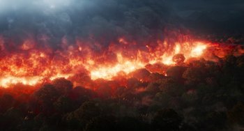 Movie still from “Avatar: The Way of Water” (2022), directed by James Cameron – A fire is burning in the middle of a forest; Extreme Wide shot, High angle