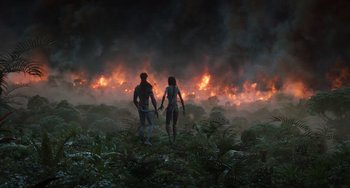 Movie still from “Avatar: The Way of Water” (2022), directed by James Cameron – A man and a woman are standing in a field; Extreme Wide shot, High angle