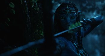 Movie still from “Avatar: The Way of Water” (2022), directed by James Cameron – A woman in a blue costume; Medium shot, Over the shoulder angle