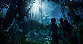 Movie still from “Avatar: The Way of Water” (2022), directed by James Cameron – A group of people standing in the middle of a forest; Wide shot, Low angle