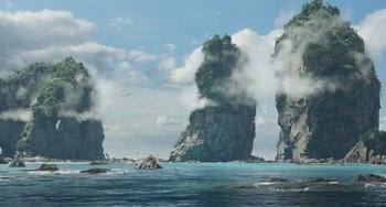 Movie still from “Avatar: The Way of Water” (2022), directed by James Cameron – A large body of water near a large rock formation; Extreme Wide shot, Low angle