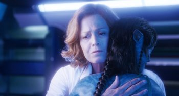 Movie still from “Avatar: The Way of Water” (2022), directed by James Cameron – A woman is holding a stuffed animal in her arms; Close Up shot, Over the shoulder angle