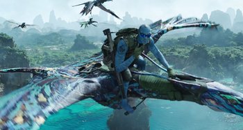 Movie still from “Avatar: The Way of Water” (2022), directed by James Cameron – An image of a man on a boat in the water; Wide shot, Over the shoulder angle