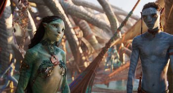 Movie still from “Avatar: The Way of Water” (2022), directed by James Cameron – A woman's body painted like an animal; Medium shot, Over the shoulder angle