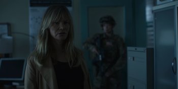 Movie still from “Awake” (2021), directed by Mark Raso – A woman standing next to a man in a military uniform; Close Up shot, Over the shoulder angle