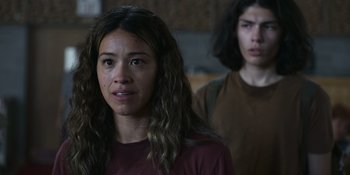 Movie still from “Awake” (2021), directed by Mark Raso – A woman and a man standing next to each other in a room; Close Up shot, Low angle