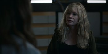 Movie still from “Awake” (2021), directed by Mark Raso – A woman with blonde hair looking into a mirror; Close Up shot, Over the shoulder angle