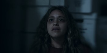 Movie still from “Awake” (2021), directed by Mark Raso – A woman with long hair looking up at the ceiling; Close Up shot, Low angle