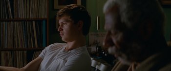 Movie still from “Baby Driver” (2017), directed by Edgar Wright – A young man and an older man sitting in front of a mirror; Close Up shot, Over the shoulder angle