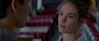 Movie still from “Baby Driver” (2017), directed by Edgar Wright – A person looking at the camera; Close Up shot, Over the shoulder angle