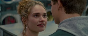 Movie still from “Baby Driver” (2017), directed by Edgar Wright – A young man and a young woman looking at one another; Close Up shot, Over the shoulder angle