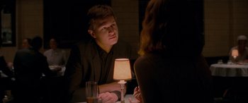 Movie still from “Baby Driver” (2017), directed by Edgar Wright – A man and a woman are sitting at a table; Close Up shot, Over the shoulder angle