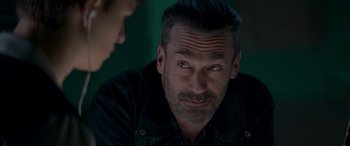 Movie still from “Baby Driver” (2017), directed by Edgar Wright – A person sitting down with another person; Close Up shot, Over the shoulder angle