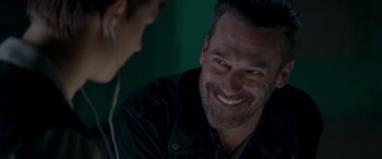 Movie still from “Baby Driver” (2017), directed by Edgar Wright – A person with a smile on their face; Close Up shot, Over the shoulder angle