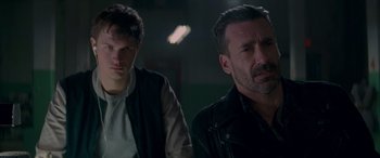 Movie still from “Baby Driver” (2017), directed by Edgar Wright – A man and a young man standing next to each other; Close Up shot, Over the shoulder angle