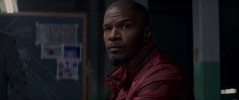 Movie still from “Baby Driver” (2017), directed by Edgar Wright – A person wearing a red jacket; Close Up shot, Over the shoulder angle