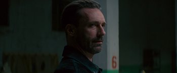 Movie still from “Baby Driver” (2017), directed by Edgar Wright – A person wearing a black shirt; Close Up shot, Over the shoulder angle