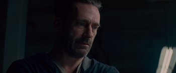 Movie still from “Baby Driver” (2017), directed by Edgar Wright – A person looking at the camera; Close Up shot, Over the shoulder angle