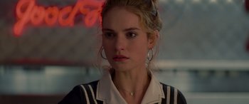 Movie still from “Baby Driver” (2017), directed by Edgar Wright – A person wearing a jacket; Close Up shot, Over the shoulder angle