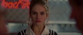 Movie still from “Baby Driver” (2017), directed by Edgar Wright – A person wearing a jacket; Close Up shot, Over the shoulder angle