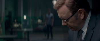 Movie still from “Baby Driver” (2017), directed by Edgar Wright – A person wearing glasses; Close Up shot, Over the shoulder angle