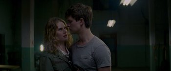 Movie still from “Baby Driver” (2017), directed by Edgar Wright – A man and a woman are kissing in a room; Close Up shot, Over the shoulder angle