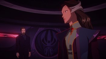 Movie still from “Babylon 5: The Road Home” (2023), directed by Matt Peters – A man and a woman are standing next to each other; Medium shot, Over the shoulder angle