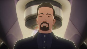 Movie still from “Babylon 5: The Road Home” (2023), directed by Matt Peters – An animated picture of a man with a beard; Close Up shot, Low angle