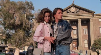 Movie still from “Back to the Future” (1985), directed by Robert Zemeckis – A man and a woman standing next to each other; Medium shot, Low angle