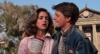 Movie still from “Back to the Future” (1985), directed by Robert Zemeckis – A man and a woman standing next to each other; Close Up shot, Low angle