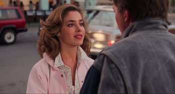 Movie still from “Back to the Future” (1985), directed by Robert Zemeckis – A woman in a pink jacket talking to a man in a pink jacket; Close Up shot, Over the shoulder angle