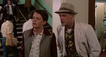 Movie still from “Back to the Future” (1985), directed by Robert Zemeckis – A man and a boy standing next to each other in a room; Medium shot, Over the shoulder angle