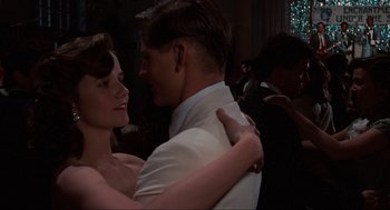 Movie still from “Back to the Future” (1985), directed by Robert Zemeckis – A man and a woman are dancing together; Close Up shot, Over the shoulder angle