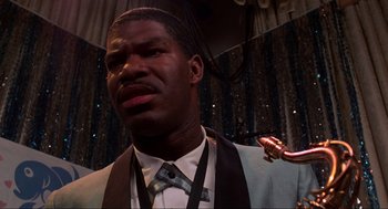 Movie still from “Back to the Future” (1985), directed by Robert Zemeckis – A person with a saxophone; Close Up shot, Low angle