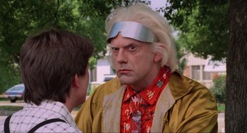 Movie still from “Back to the Future Part II” (1989), directed by Robert Zemeckis – A man with a strange look on his face and another man with a strange look on his face; Close Up shot, Over the shoulder angle