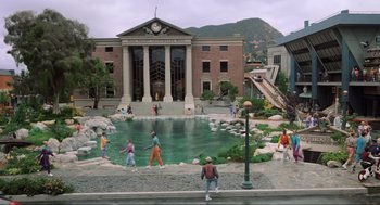 Movie still from “Back to the Future Part II” (1989), directed by Robert Zemeckis – A group of people playing a game in a pond; Extreme Wide shot, High angle
