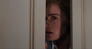 Movie still from “Back to the Future Part II” (1989), directed by Robert Zemeckis – A person looking out of a window; Close Up shot, Low angle