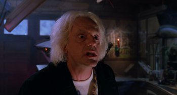 Movie still from “Back to the Future Part II” (1989), directed by Robert Zemeckis – An old man with blonde hair and a white wig; Close Up shot, Low angle