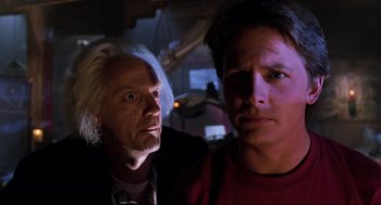 Movie still from “Back to the Future Part II” (1989), directed by Robert Zemeckis – A man and a woman are looking at the camera; Close Up shot, Over the shoulder angle