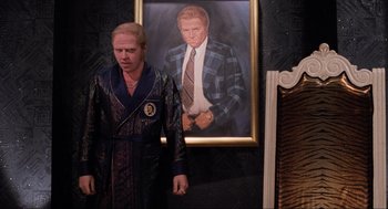 Movie still from “Back to the Future Part II” (1989), directed by Robert Zemeckis – A man standing in front of a painting of himself; Medium shot, Low angle