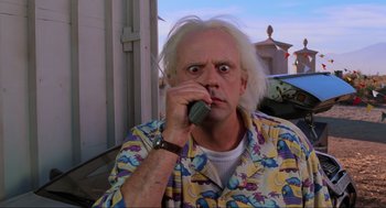 Movie still from “Back to the Future Part II” (1989), directed by Robert Zemeckis – An old man with white hair talking on a cell phone; Close Up shot, Low angle