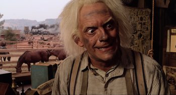Movie still from “Back to the Future Part III” (1990), directed by Robert Zemeckis – A person wearing a wig; Close Up shot, Over the shoulder angle