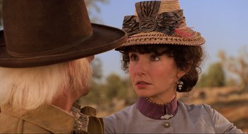 Movie still from “Back to the Future Part III” (1990), directed by Robert Zemeckis – An older man and a woman talking to each other; Close Up shot, Over the shoulder angle