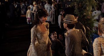Movie still from “Back to the Future Part III” (1990), directed by Robert Zemeckis – A man and a woman talking to each other in front of a crowd; Medium shot, Over the shoulder angle